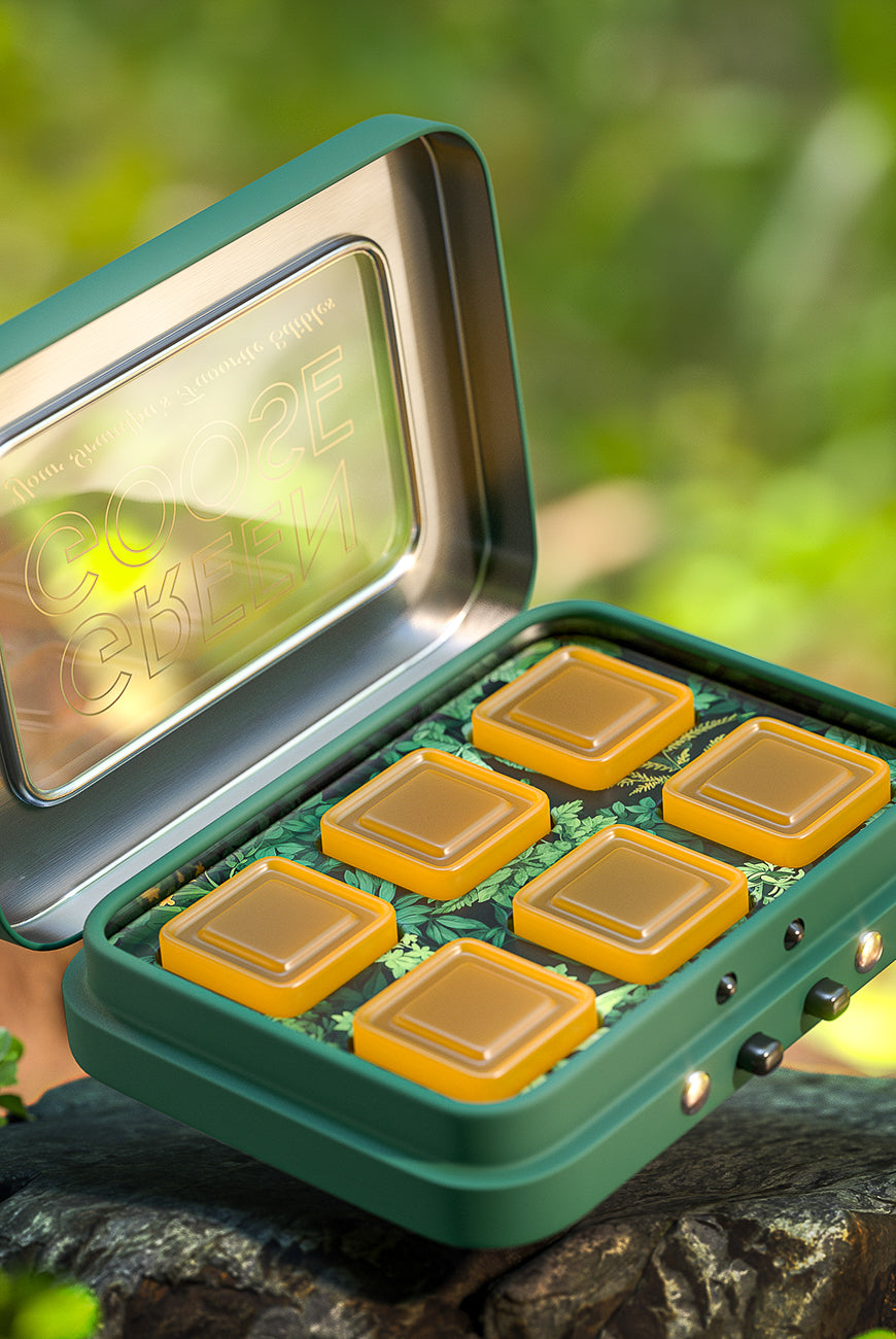 Portable tin with individual gold compartments, designed for sleek and secure product storage.