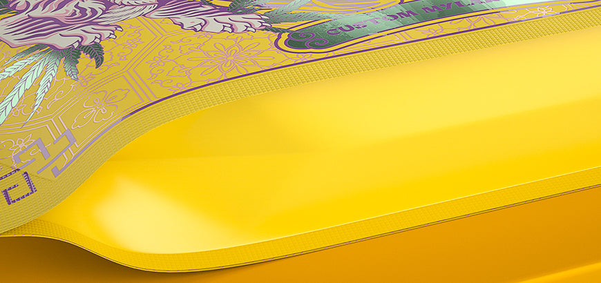 Yellow flexible packaging roll with detailed custom prints, crafted for durable and colorful product wrapping.