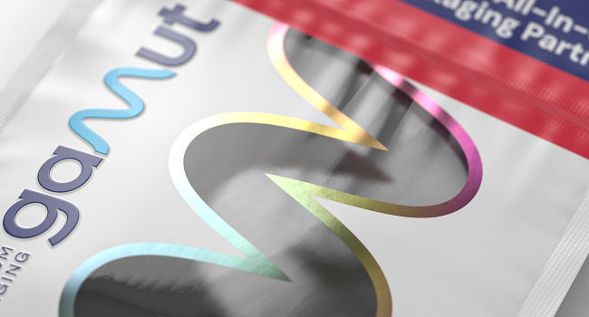 Close-up of a white custom printed mylar bag with a clear squiggly window showing the bag's contents.