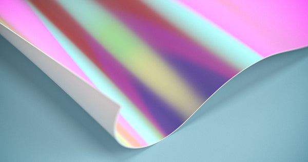 A closeup view of holographic film roll showcasing the spectrum of colors that can be customized.